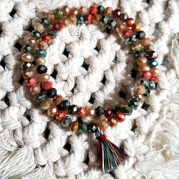 Crystal rondelle beaded double stretch bracelet with tassel charm. 6mm beads. - Picture 1 of 4